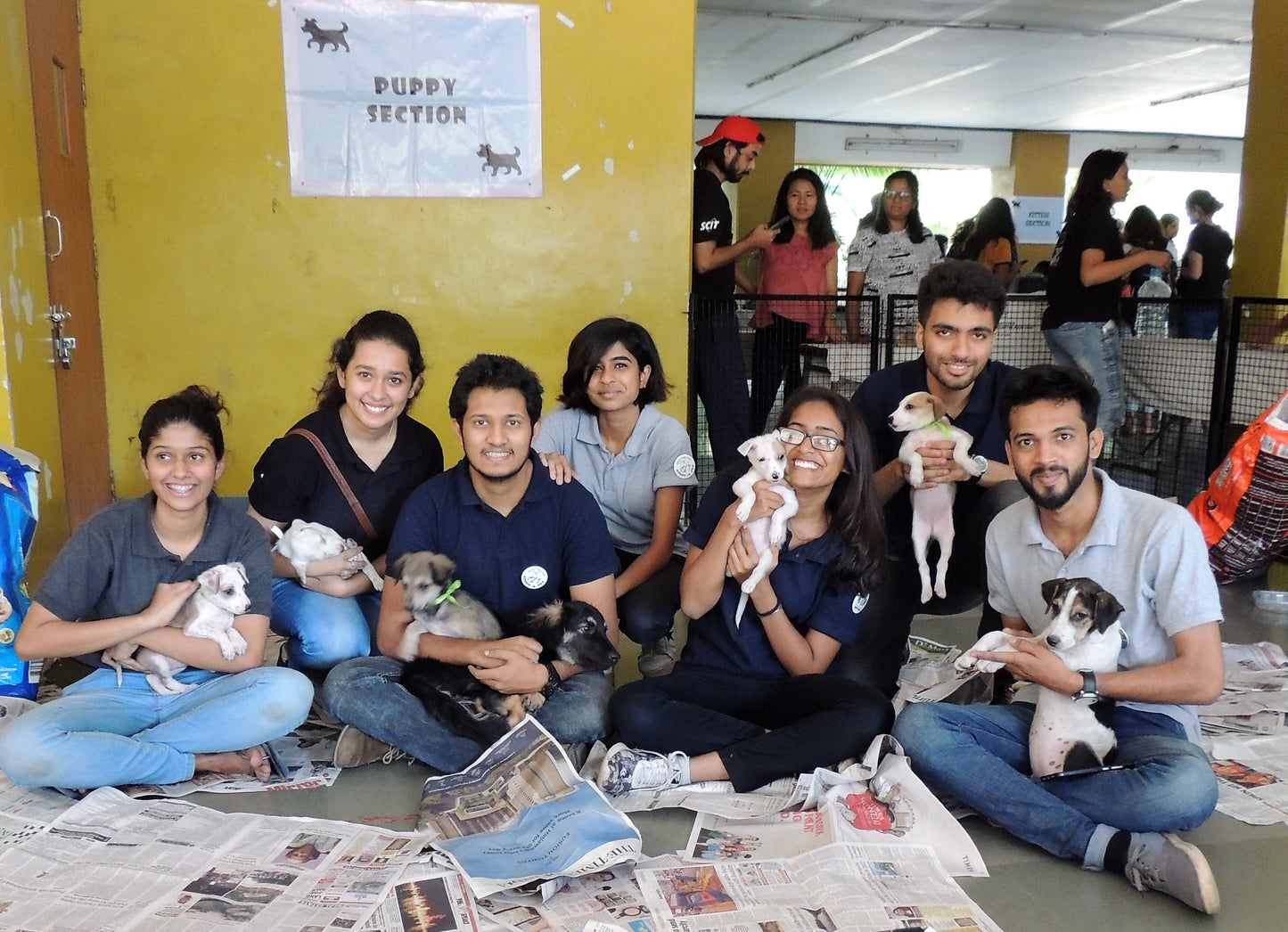 Volunteers with puppies