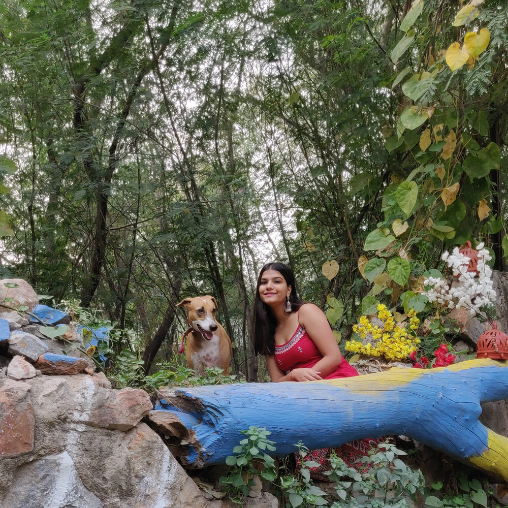 Woman with her dog in the forest