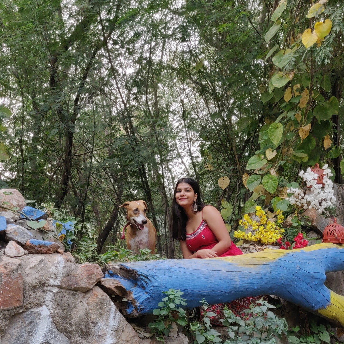 Woman with her dog in the forest