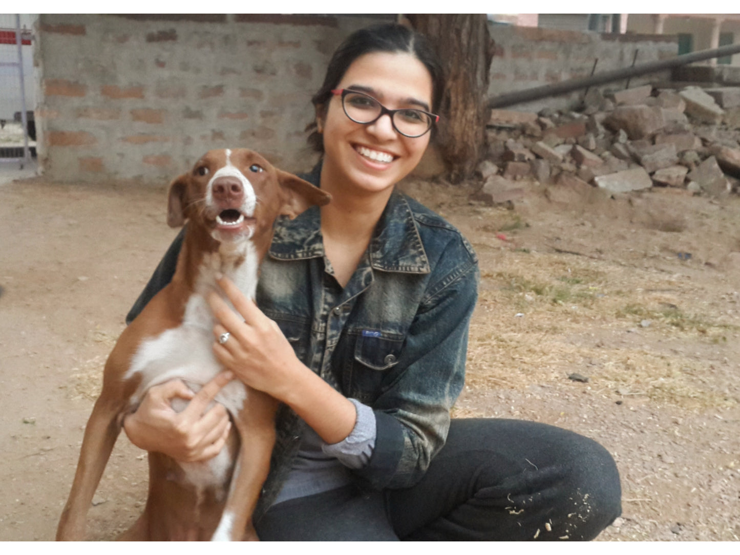 Woman with a dog sitting outdoors