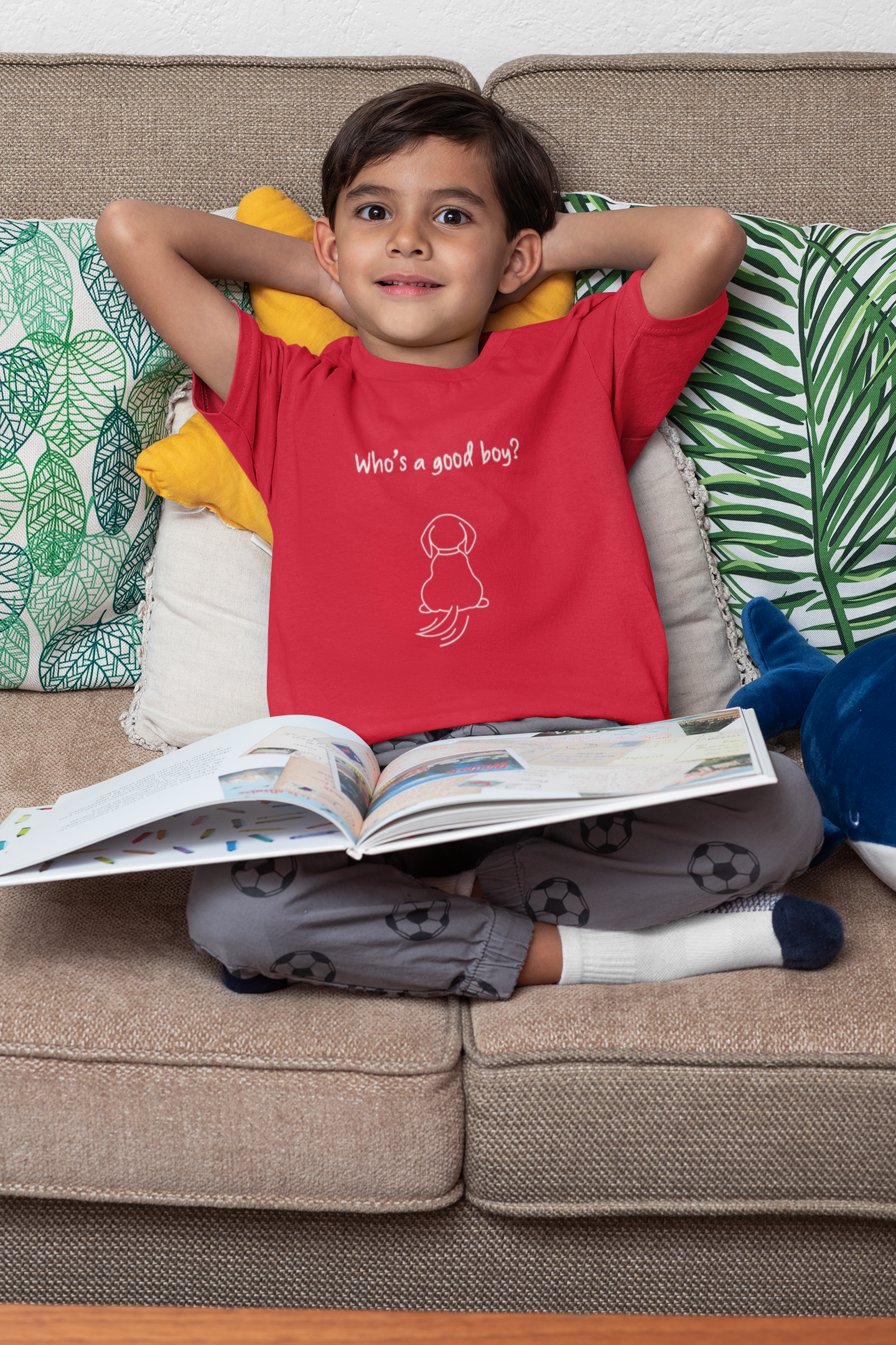 Boy wearing who's a good boy t-shirt for dog lovers